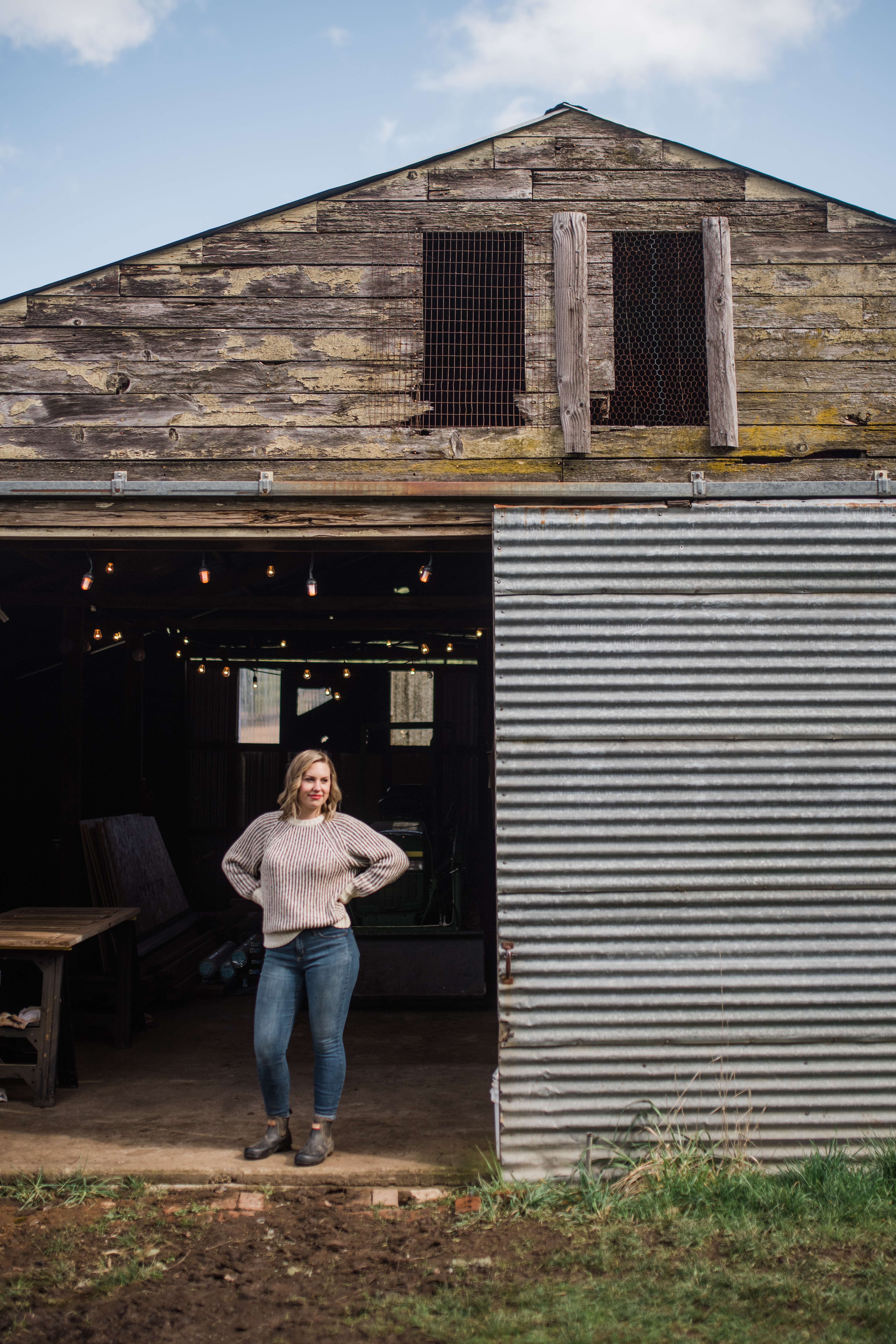 Kaylene standing in front of her barn 